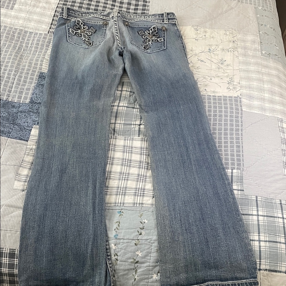 Elegant Blue Flare Jeans with Embellished Pockets